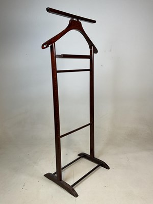 Lot 524 - A wooden freestanding valet suit stand, and a...