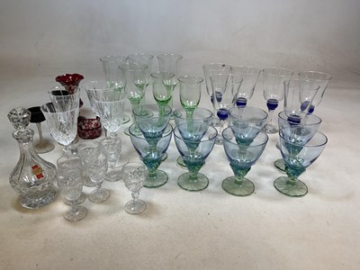 Lot 412 - A collection of drinking glasses in green and...