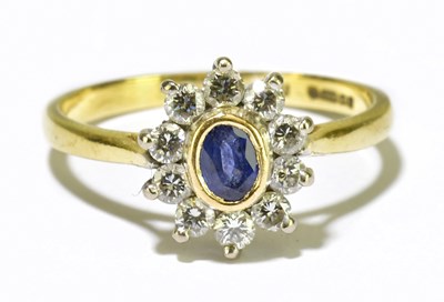 Lot 65 - An 18ct yellow gold sapphire and diamond ring...