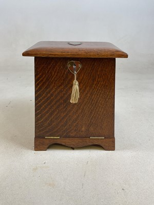 Lot 483 - An oak Arts and Crafts desk top stationary box,...