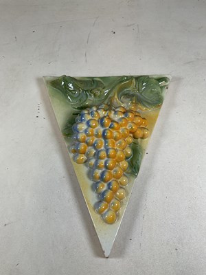 Lot 259 - A decorative ceramic wall plaque featuring a...