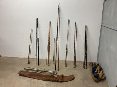 Lot 63 - A collection of 8 fishing rods, some with...