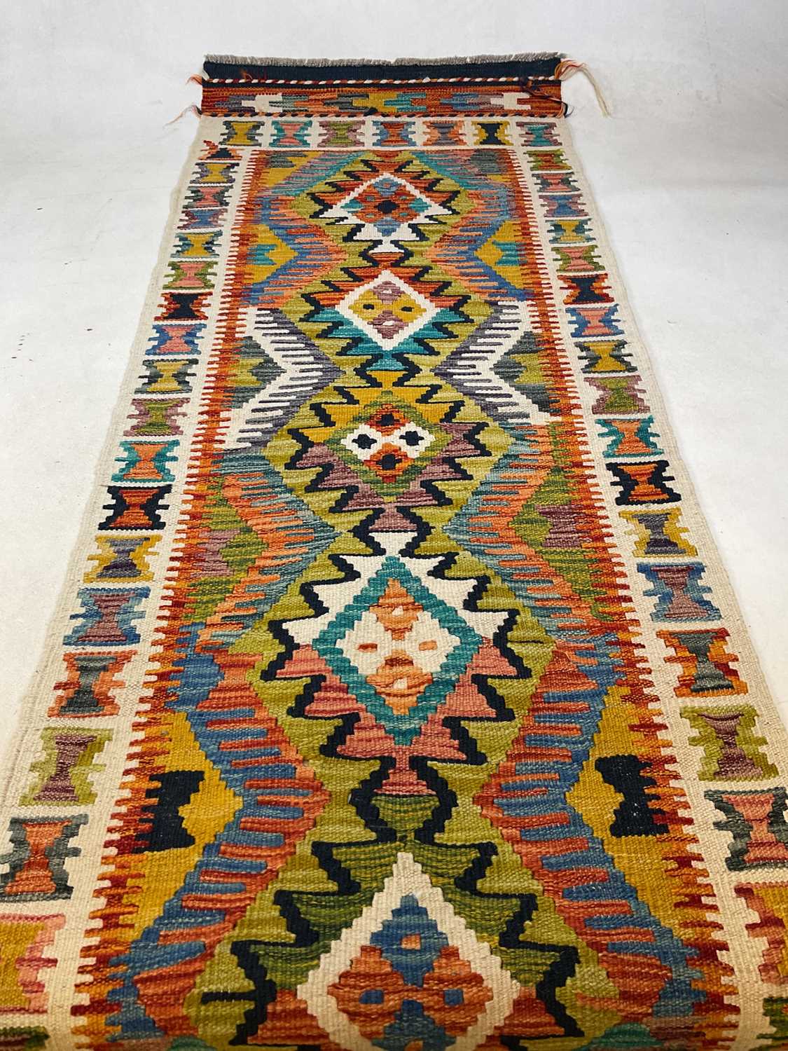 Lot 430 - A Chobi Kilim runner, 190cm x 65cm