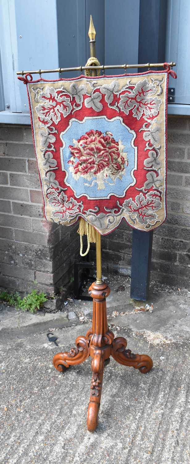 Lot 26 - A Victorian firescreen, the beaded tapestry...