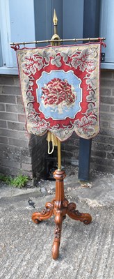 Lot 22 - A Victorian firescreen, the beaded tapestry...