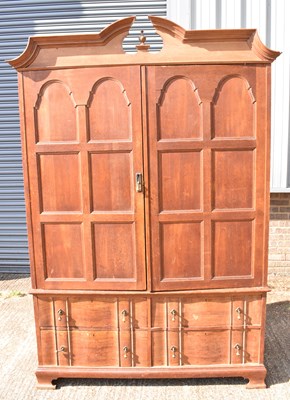 Lot 24 - A large Continental oak wardrobe with pair of...