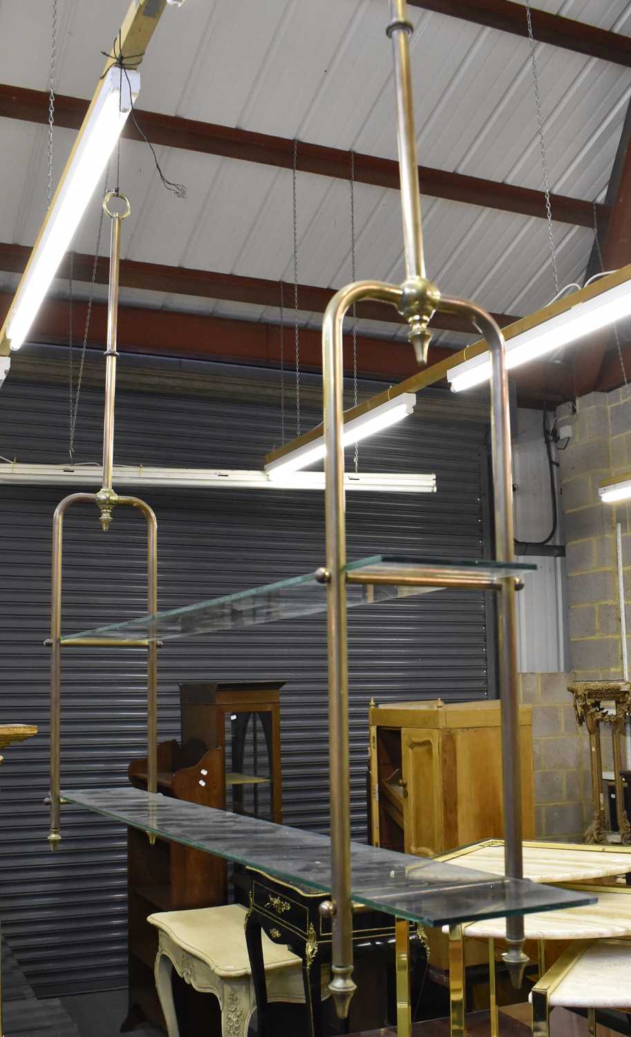 Lot 241 - Two tubular brass framed butcher's hanging...