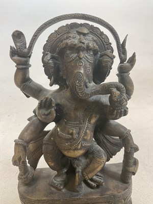 Lot 240 - An antique bronze Ganesh statue, height 24cm.