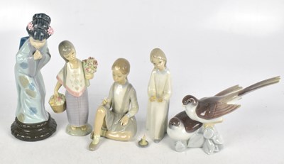 Lot 432 - LLADRO; a collection of four ceramic figures...