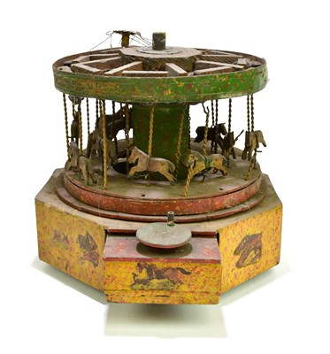 Lot 260 - A circa 1900s winding carousel, height 24cm.