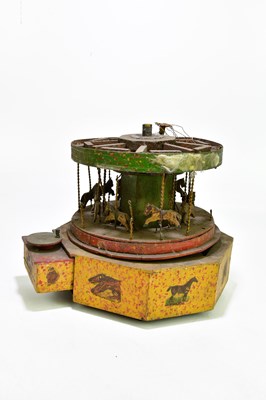 Lot 260 - A circa 1900s winding carousel, height 24cm.