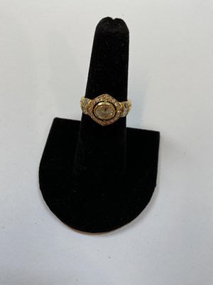 Lot 298 - A yellow metal diamond ring with oval collet...