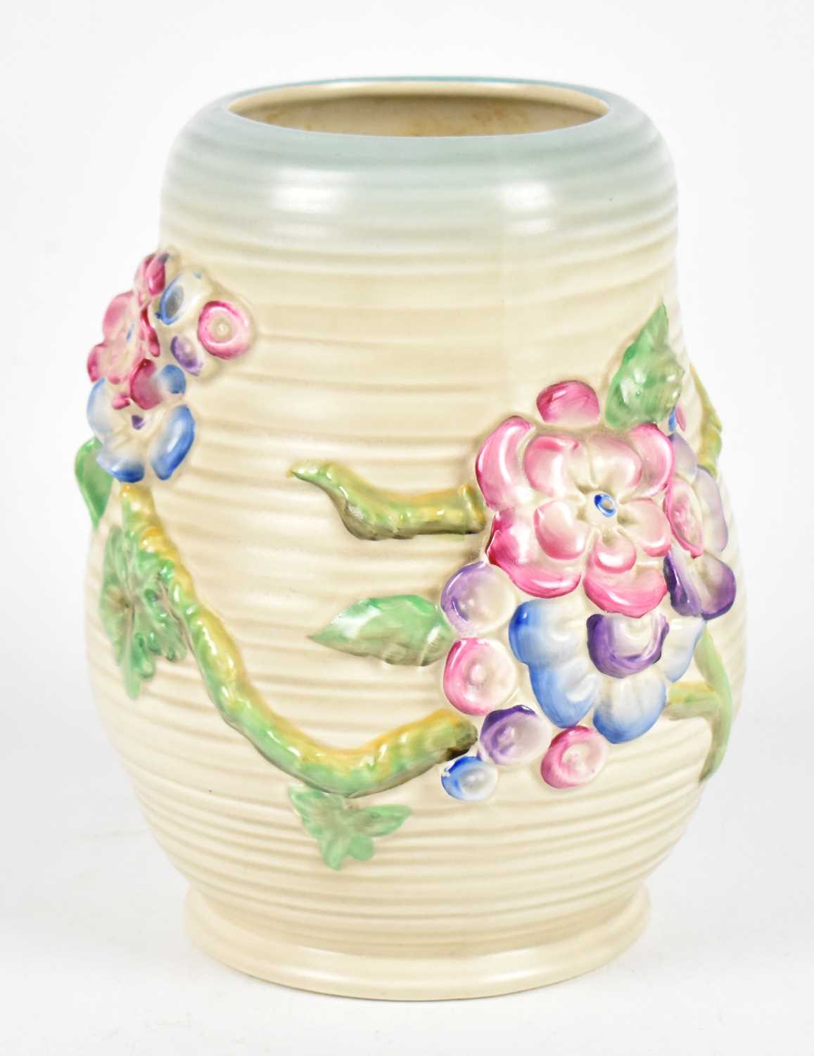 Lot 382 - CLARICE CLIFFE; a Newport Pottery ribbed floral decorated vase