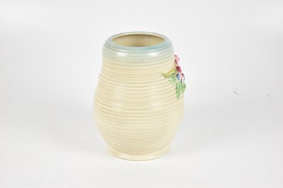 Lot 382 - CLARICE CLIFFE; a Newport Pottery ribbed floral decorated vase