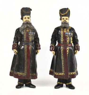 Lot 53 - A pair of Russian cold painted metal figures of Cossacks in the manner of Faberge