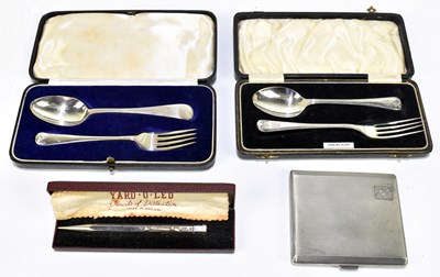 Lot 1091 - Two cased George V hallmarked silver christening spoons and forks