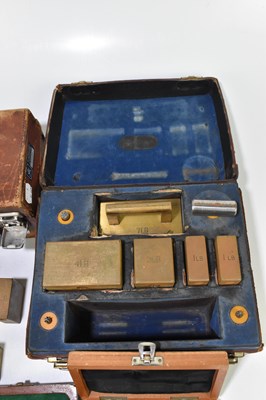 Lot 215 - A collection of part cased brass weights