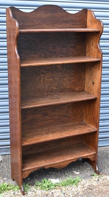 Lot 51 - An oak waterfall type bookcase, width 76cm,...