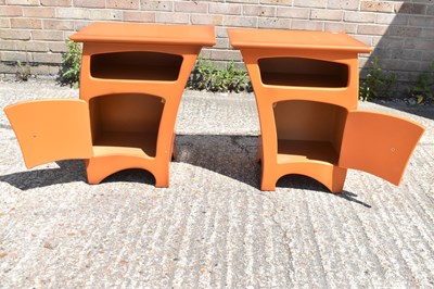 Lot 65 - A pair of modern orange bedside tables, width...