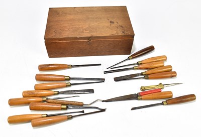 Lot 222 - A group of fourteen turned wooden handled chisels