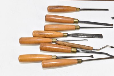 Lot 222 - A group of fourteen turned wooden handled chisels