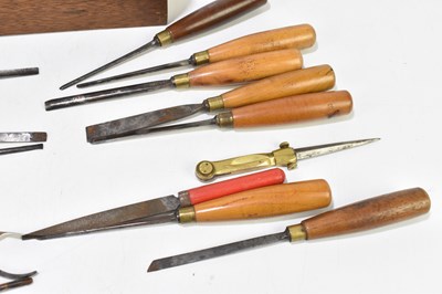 Lot 222 - A group of fourteen turned wooden handled chisels