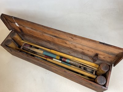 Lot 22 - A pine cased vintage croquet set comprising 4...