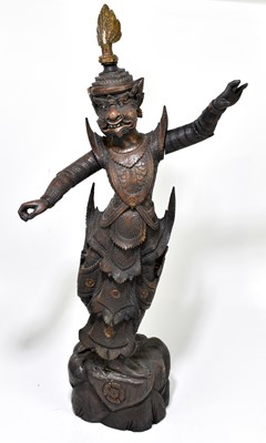 Lot 646 - An early 20th century carved wooden Thai figure