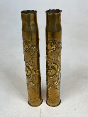 Lot 174 - A pair of World War 1 period brass 'Trench Art'...