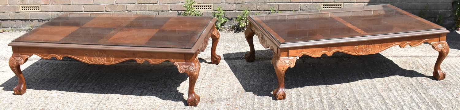 Lot 45 - A pair of reproduction mahogany coffee tables...