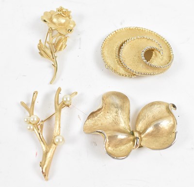 Lot 644 - TRIFARI; four brooches, one modelled as a rose...