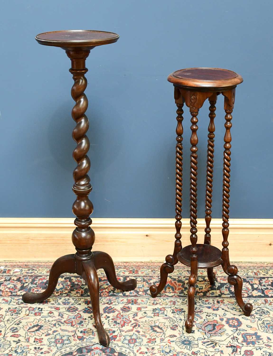 Lot 1722 - Two mahogany plants stands, largest with twist...