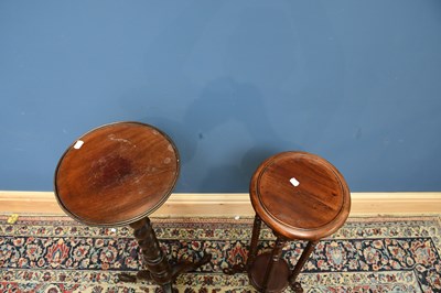 Lot 1722 - Two mahogany plants stands, largest with twist...