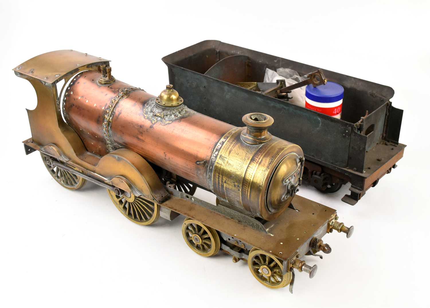 Lot 24 - A copper and brass part built locomotive,...