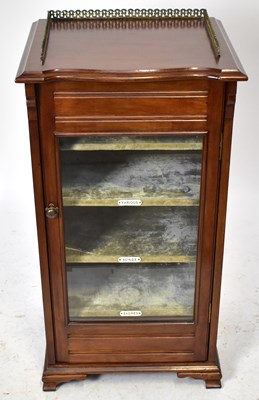 Lot 1599 - An Edwardian mahogany music cabinet with...