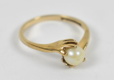 Lot 649 - A 9ct yellow gold ring set with central pearl,...