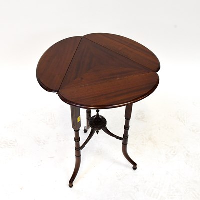 Lot 44 - A reproduction mahogany triangular-topped wine...