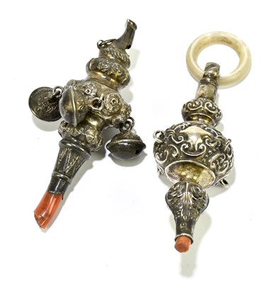 Lot 2481 - Two silver rattles, each with remants of coral...
