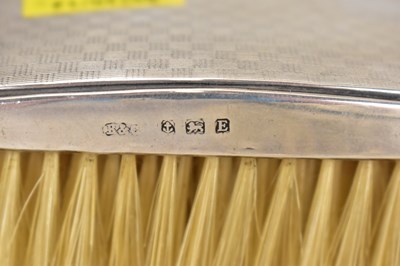 Lot 744 - Two hallmarked silver clad clothes brushes,...