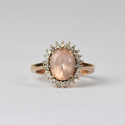 Lot 970 - A 9ct yellow gold quartz and diamond chip ring,...