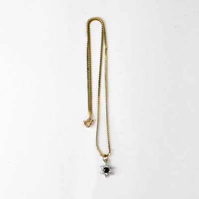 Lot 1119 - A 9ct yellow gold chain with floral sapphire...