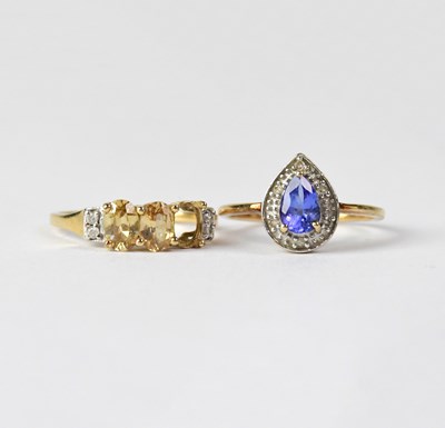 Lot 1004 - A 9ct yellow gold dress ring set with teardrop...
