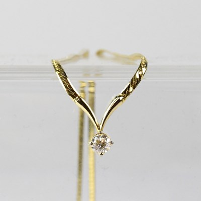 Lot 1130 - A yellow metal flat link necklace with single...