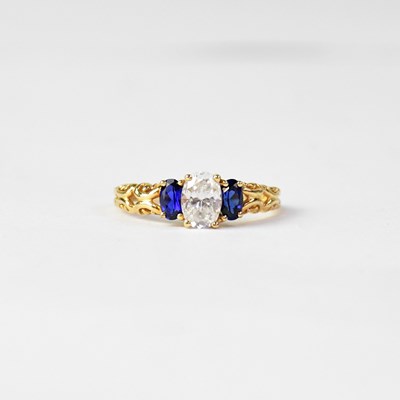 Lot 951 - A 14ct yellow gold dress ring set with central...