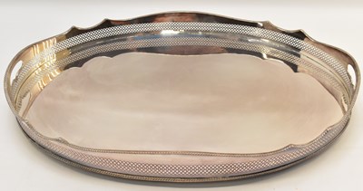 Lot 707 - A large oval silver plate tray with tall wavy...