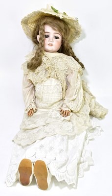 Lot 65 - MAX HANDWERCK; a German bisque headed doll...