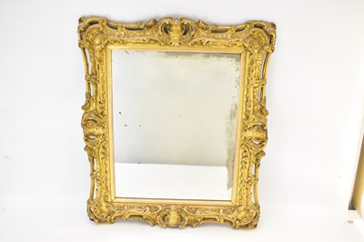 Lot 79 - A 19th century distressed mirror in an ornate...