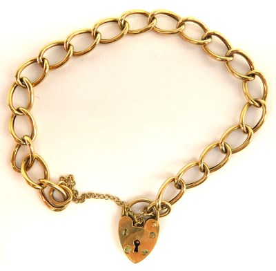 Lot 1043 - A 9ct gold oval link bracelet with 9ct gold...