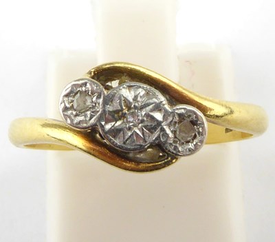 Lot 1008 - An 18ct gold three-stone illusion set diamond...