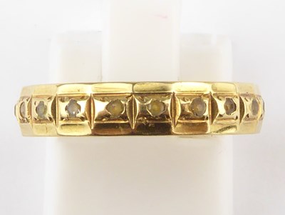Lot 976 - An 18ct gold eternity ring size M, approx. 2.5g